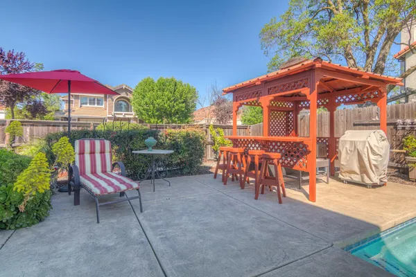 a backyard of a house with seating space