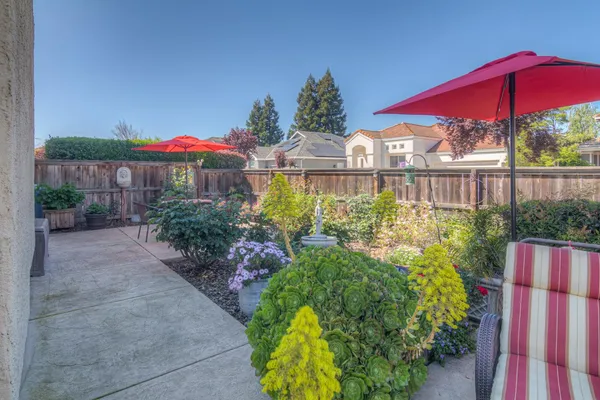 a view of a house with a flower garden