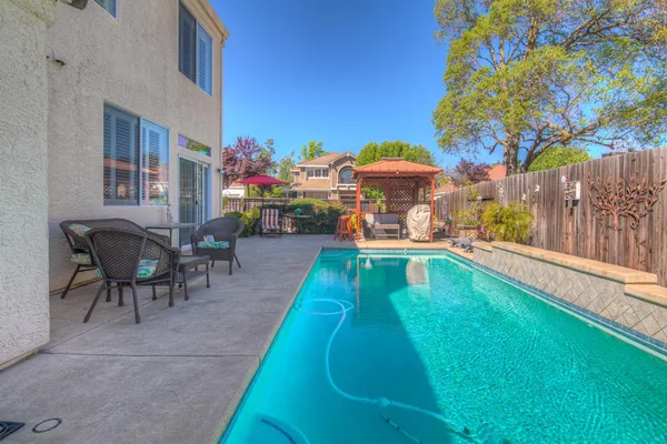an aerial view of houses with outdoor space