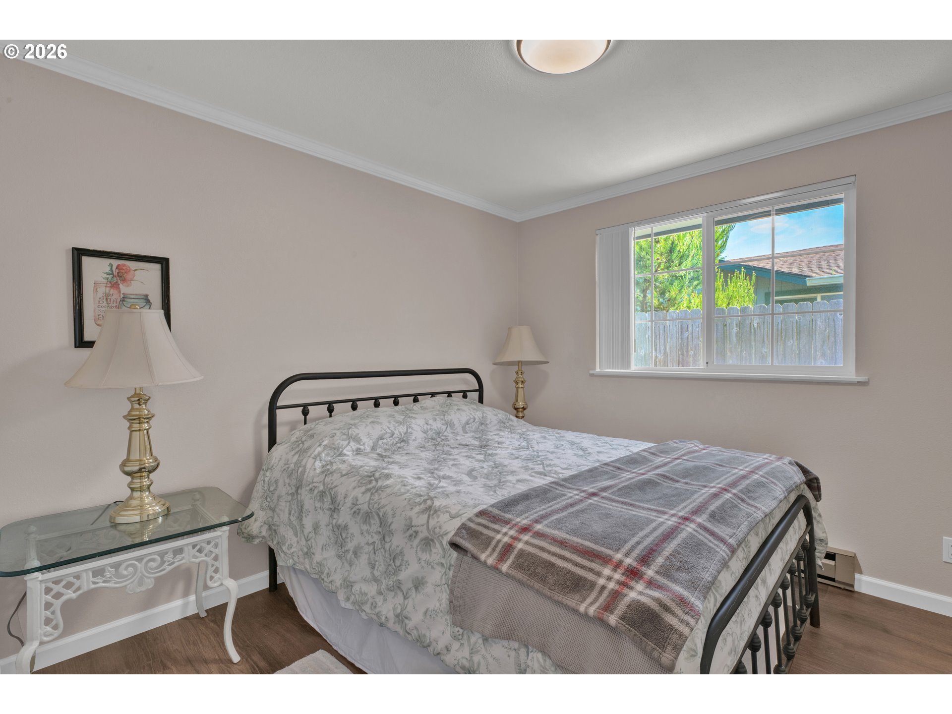 1142 9th Street Florence, OR 97439 - Photo 23 of 41 a bedroom with a bed and a window