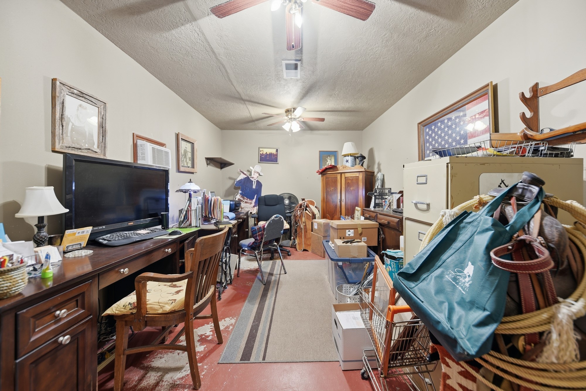 6950 Old Mill Creek Road Brenham, TX 77833 - Photo 24 of 40 a view of a workspace with furniture and a flat screen tv