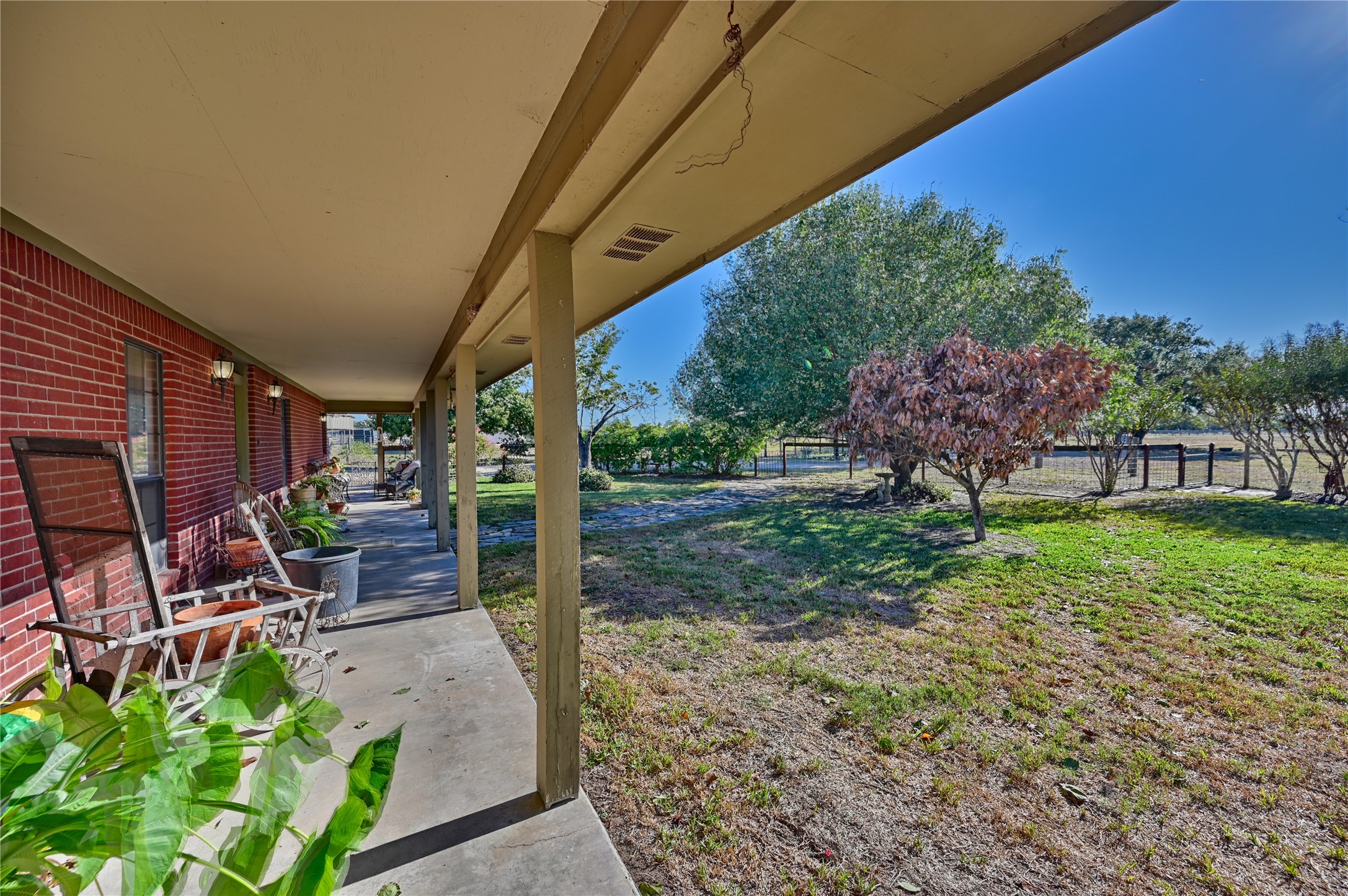 6950 Old Mill Creek Road Brenham, TX 77833 - Photo 3 of 40 a view of a chairs and table in backyard