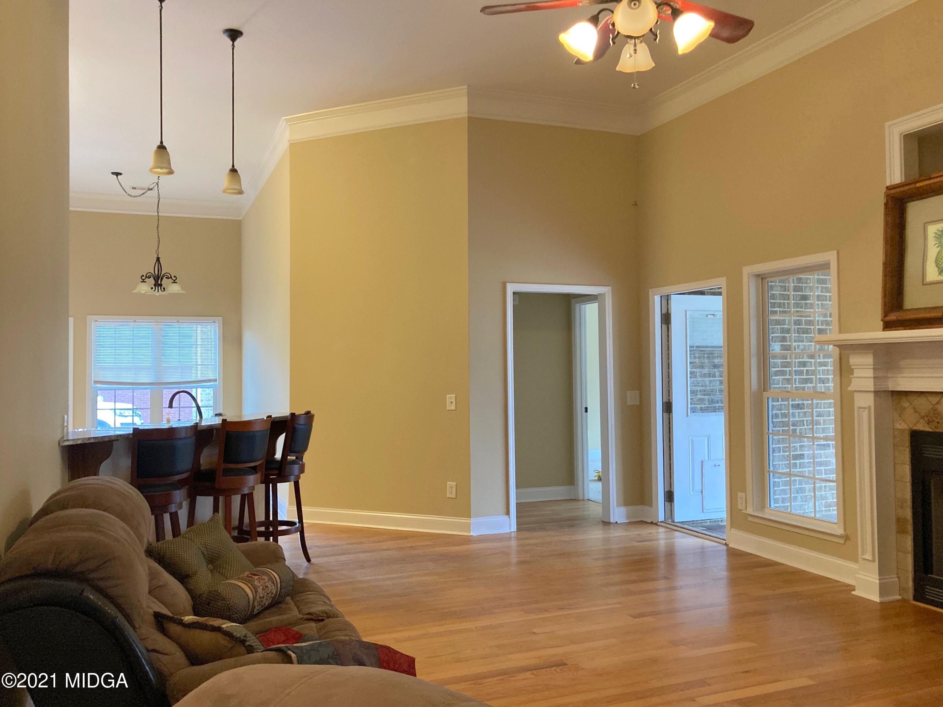 3640 Jones Road Macon, GA 31216 - Photo 3 of 39 a living room with furniture and a chandelier