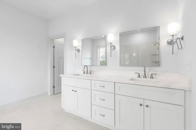 a bathroom with 2 sink tub and a mirror