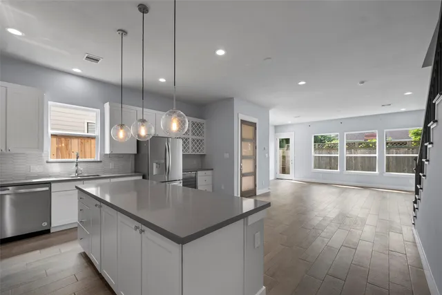 en empty room with a ceiling fan and window