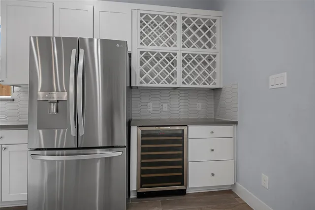 a bathroom with double vanity sinks and a large mirror