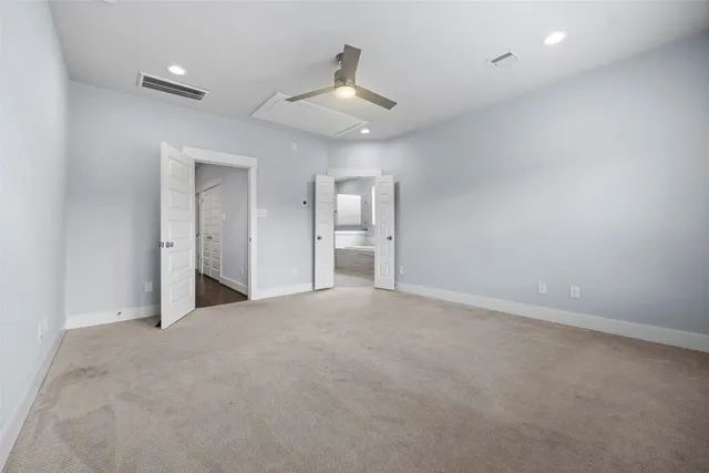 a kitchen with a refrigerator and a stove top oven