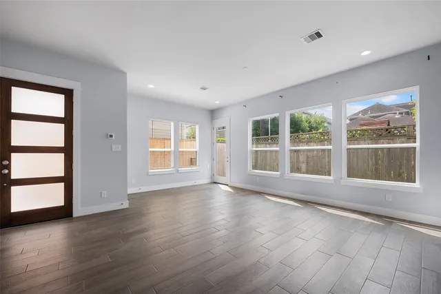 a kitchen with cabinets and stainless steel appliances