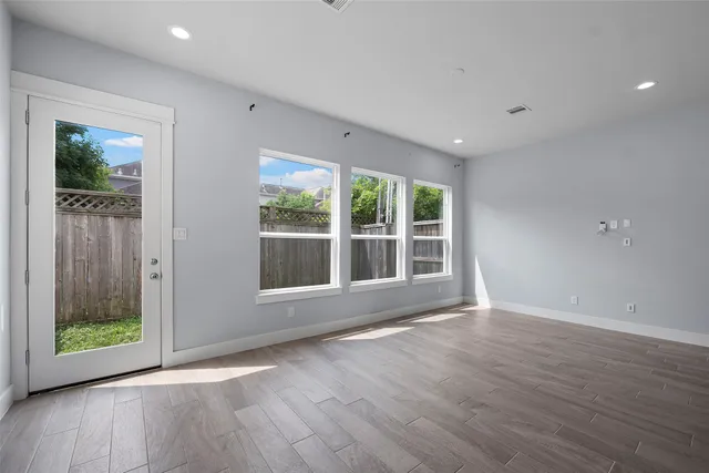 a kitchen with stainless steel appliances a sink a stove and cabinets