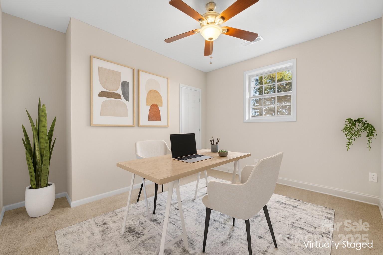5613 Springs Road Conover, NC 28613 - Photo 13 of 23 a view of a workspace with furniture and a potted plant