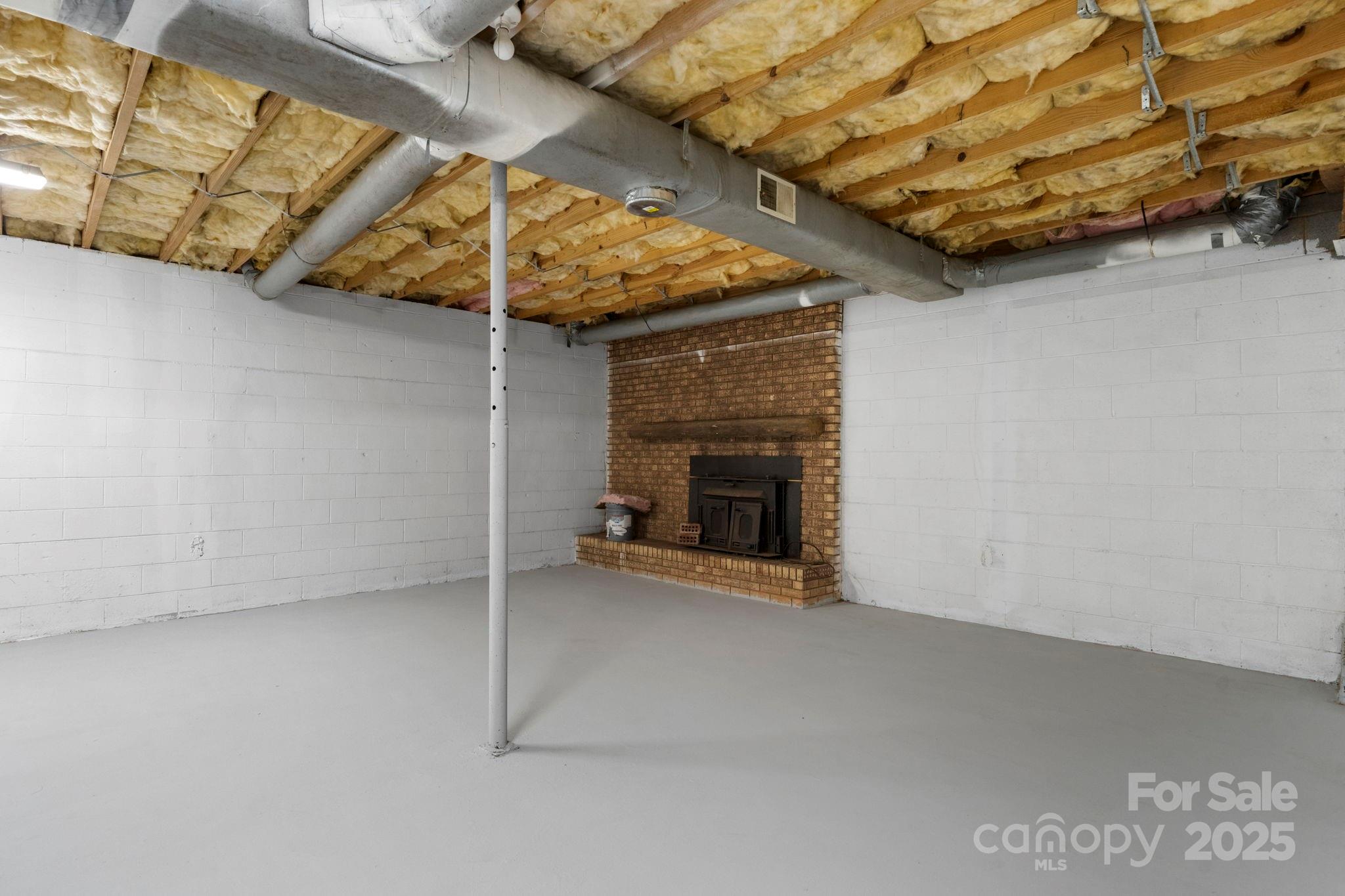 5613 Springs Road Conover, NC 28613 - Photo 20 of 23 a view of an empty room with a fireplace