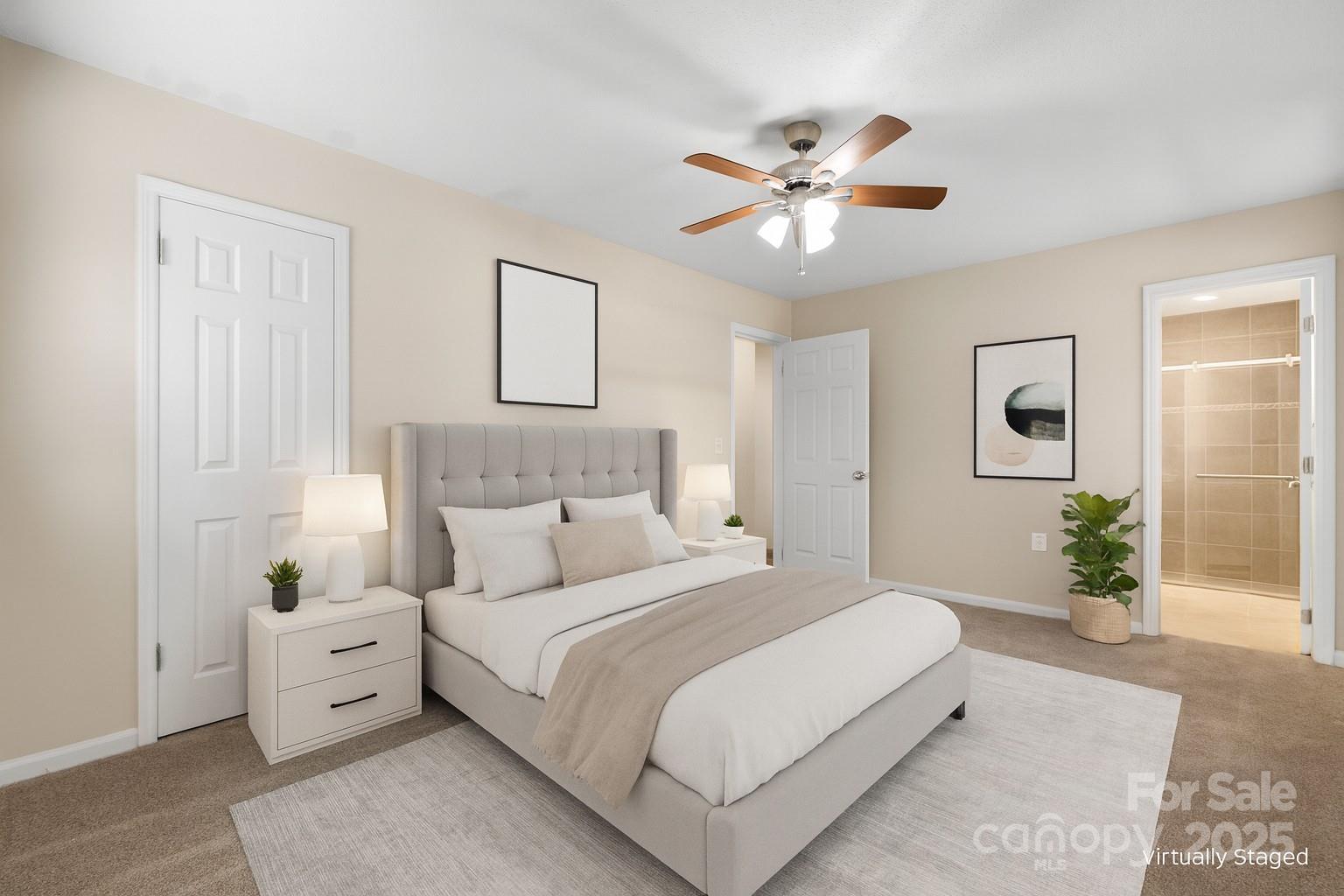 5613 Springs Road Conover, NC 28613 - Photo 8 of 23 a spacious bedroom with a large bed and a chandelier