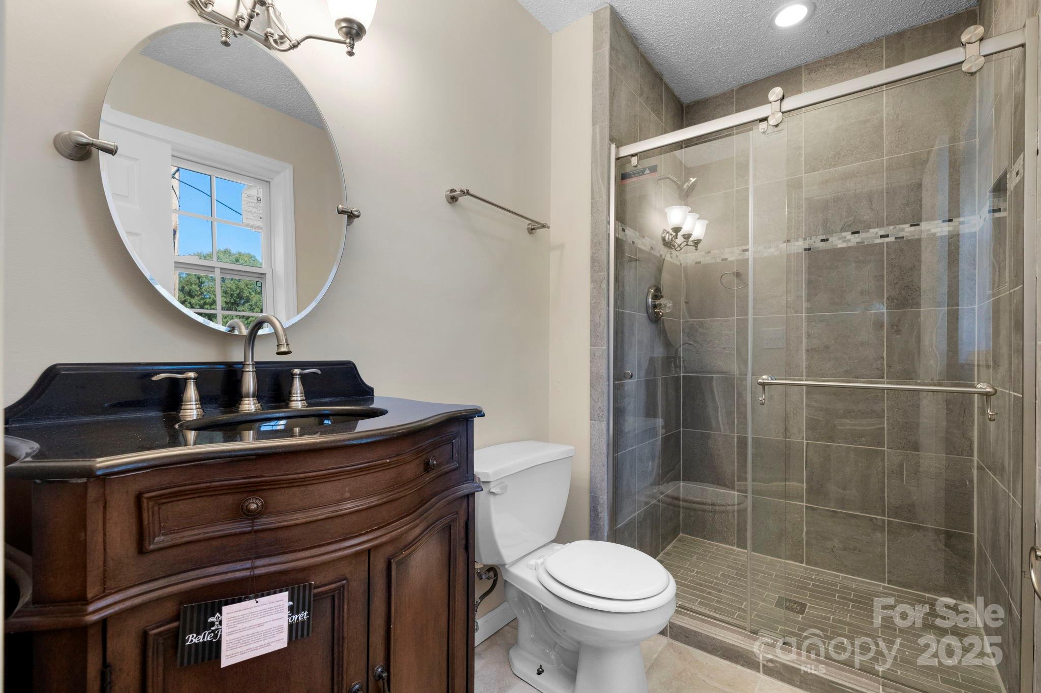 5613 Springs Road Conover, NC 28613 - Photo 9 of 23 a bathroom with a sink a toilet and shower