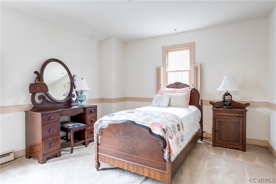 13521 Kingsmill Road Midlothian, VA 23113 - Photo 28 of 50 a bedroom with a bed a dresser and a window