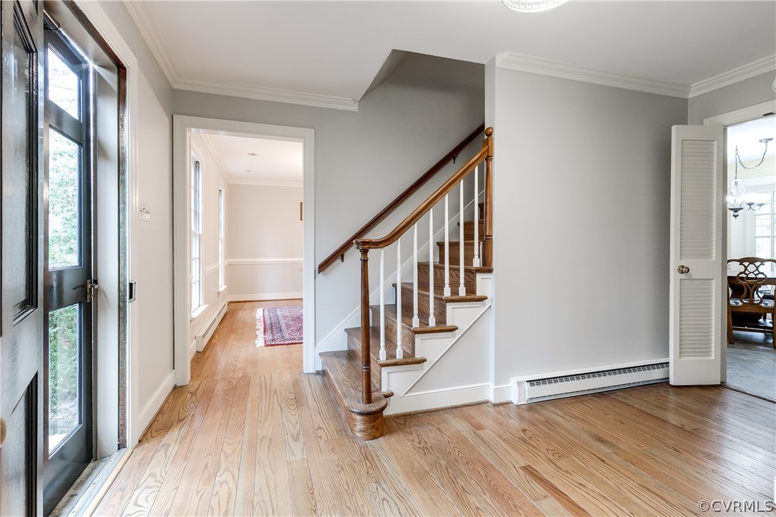 13521 Kingsmill Road Midlothian, VA 23113 - Photo 8 of 50 a view of a hallway with wooden floor and staircase