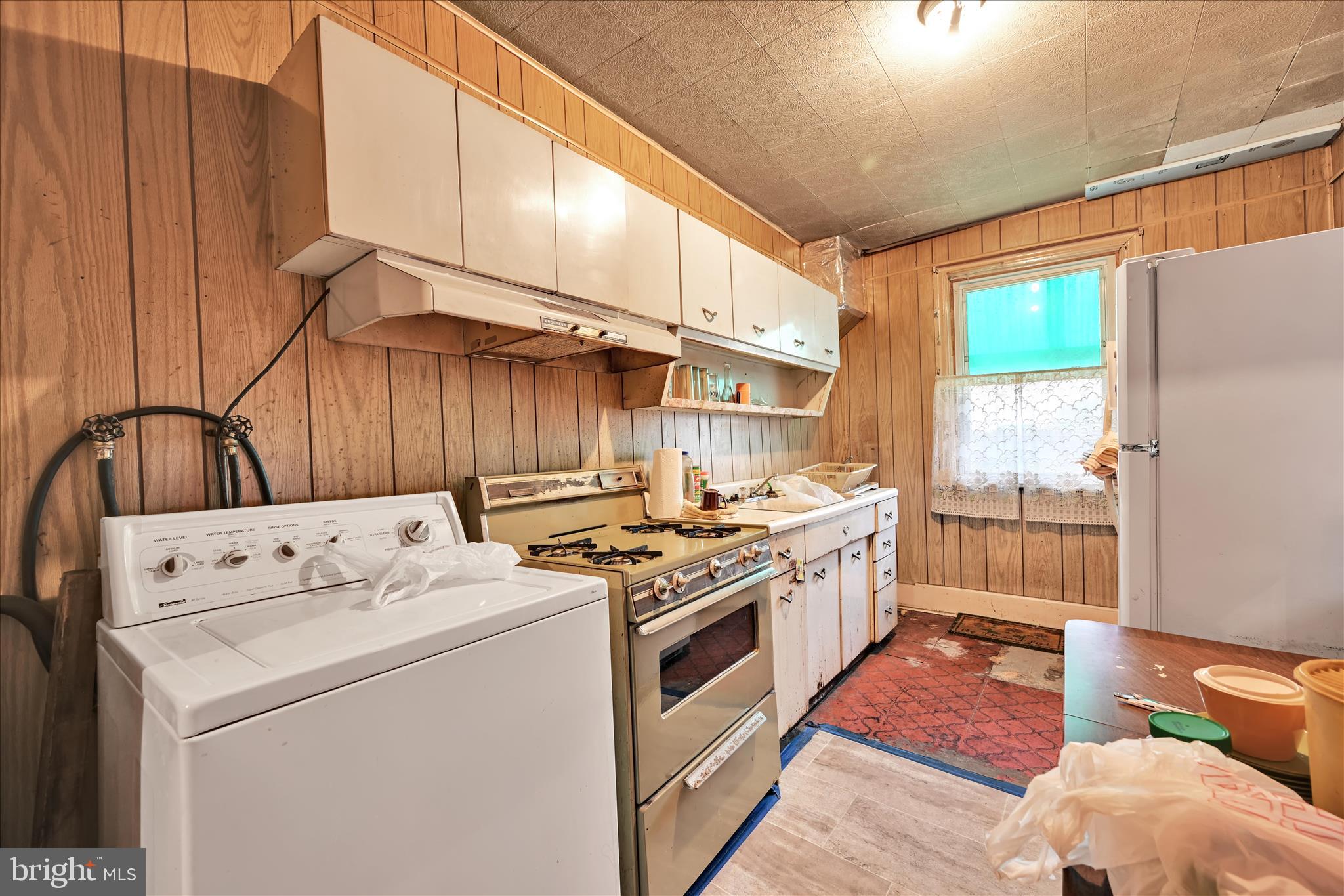 355 South 9th Street Lebanon, PA 17042 - Photo 11 of 29 a kitchen with a stove a sink and a refrigerator