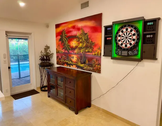 a kitchen with stainless steel appliances kitchen island granite countertop a refrigerator and a stove top oven