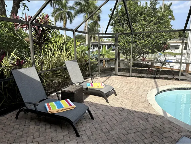 a view of a balcony with chairs