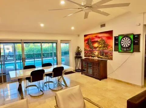 a view of a livingroom with furniture and workspace