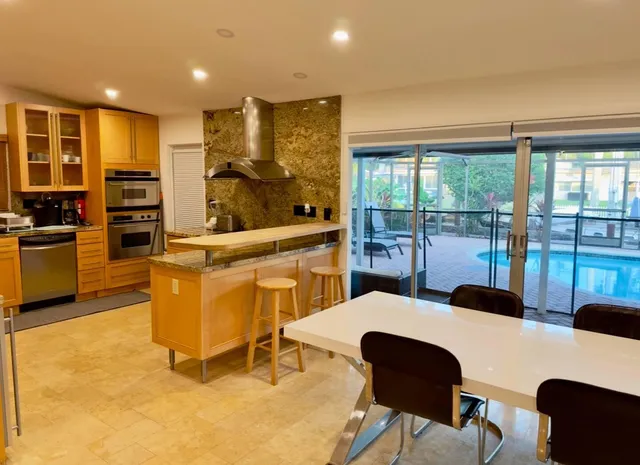 a large bedroom with a large bed and furniture