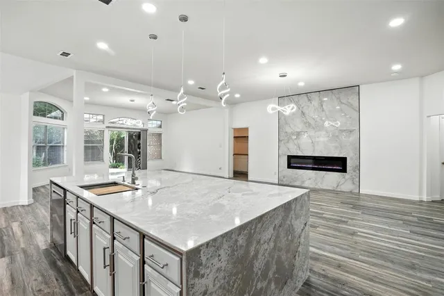 a kitchen with sink and center island