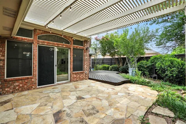 a view of a backyard of the house