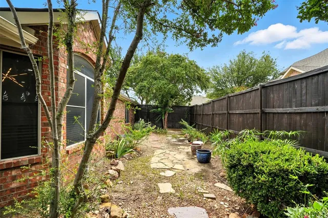 a view of a backyard with plants
