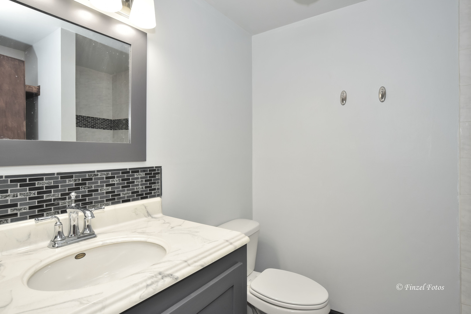 8558 South Rood Road Kingston, IL 60145 - Photo 14 of 16 a bathroom with a sink toilet and mirror