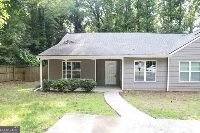 a house view with a garden space