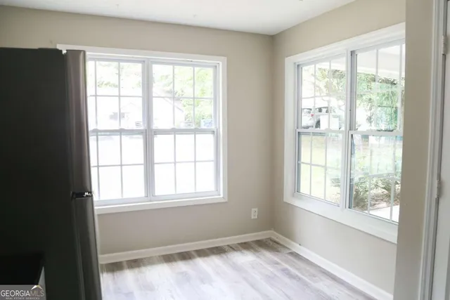 a view of an empty room with a window