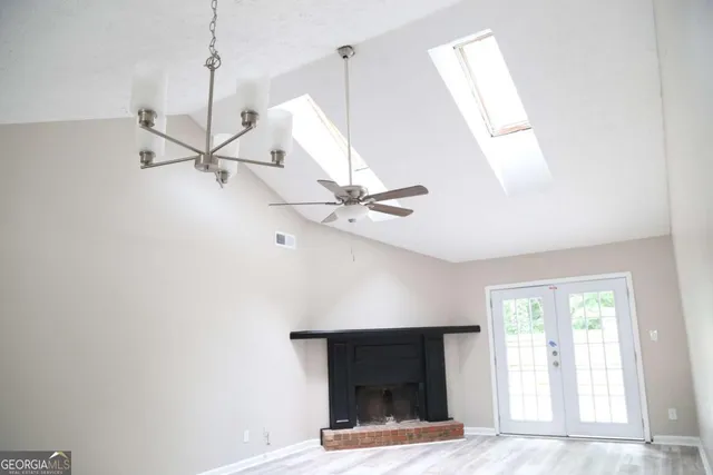 a living room with a fireplace furniture and a window