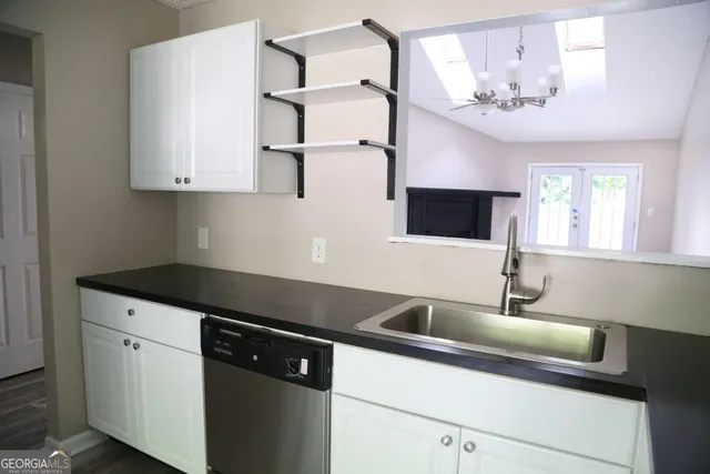a kitchen with a sink and a cabinets