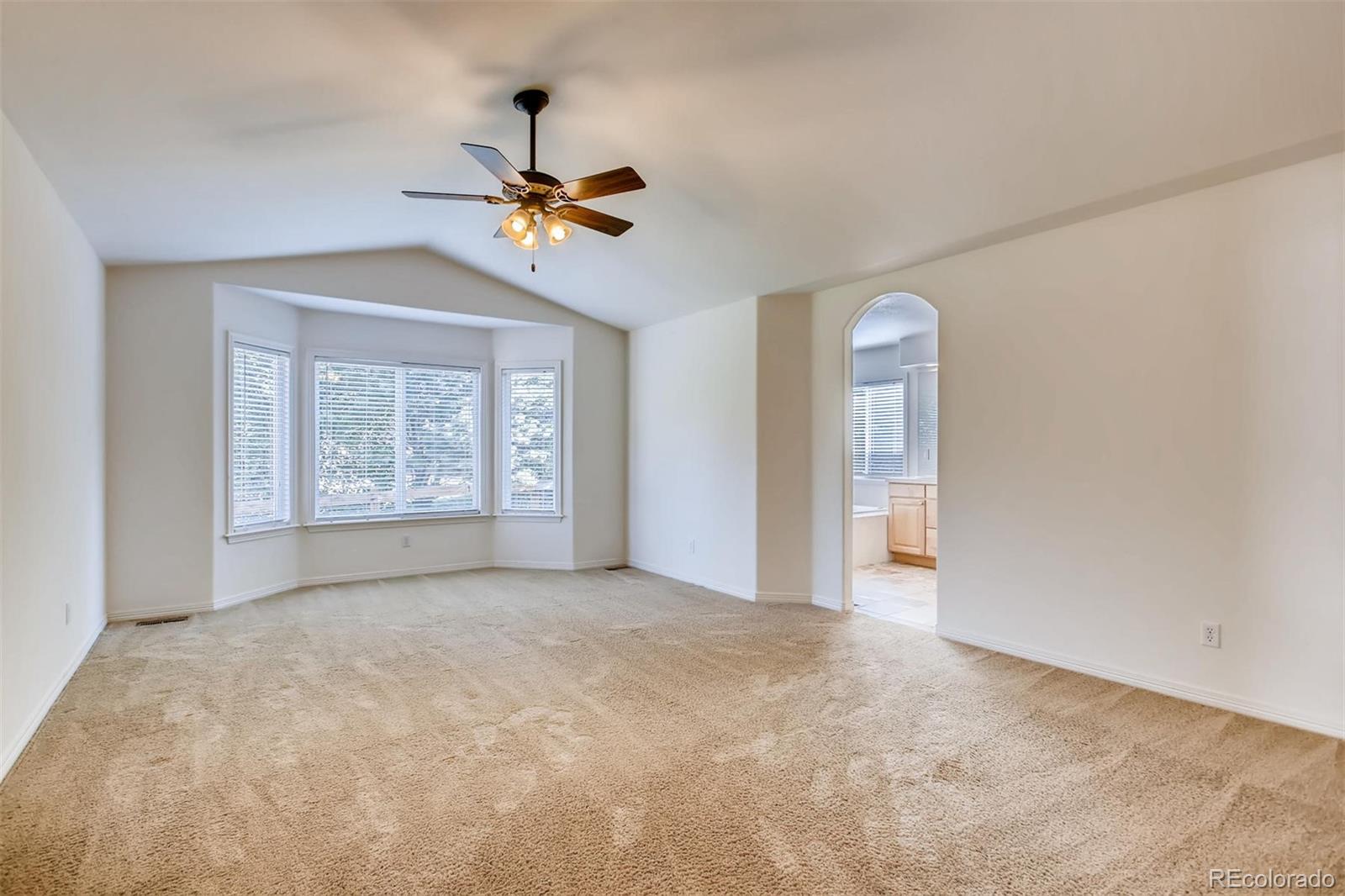 9535 East Aspen Hill Place Lone Tree, CO 80124 - Photo 16 of 28 wooden floor in an empty room with a window