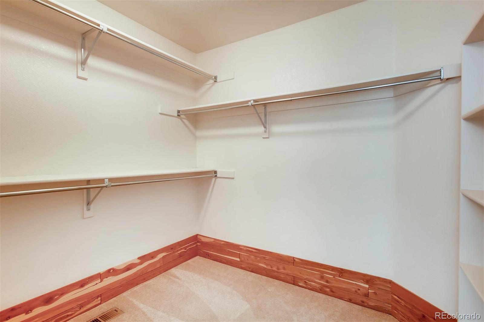 9535 East Aspen Hill Place Lone Tree, CO 80124 - Photo 20 of 28 a view of a room with shelf on the wall