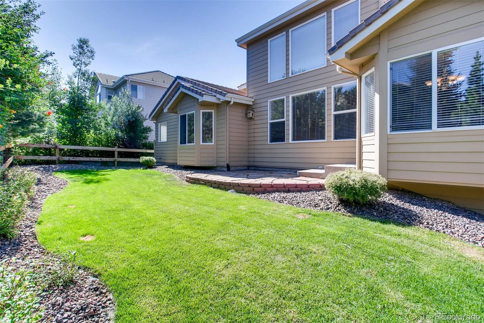 9535 East Aspen Hill Place Lone Tree, CO 80124 - Photo 28 of 28 a view of a house with a yard and sitting area
