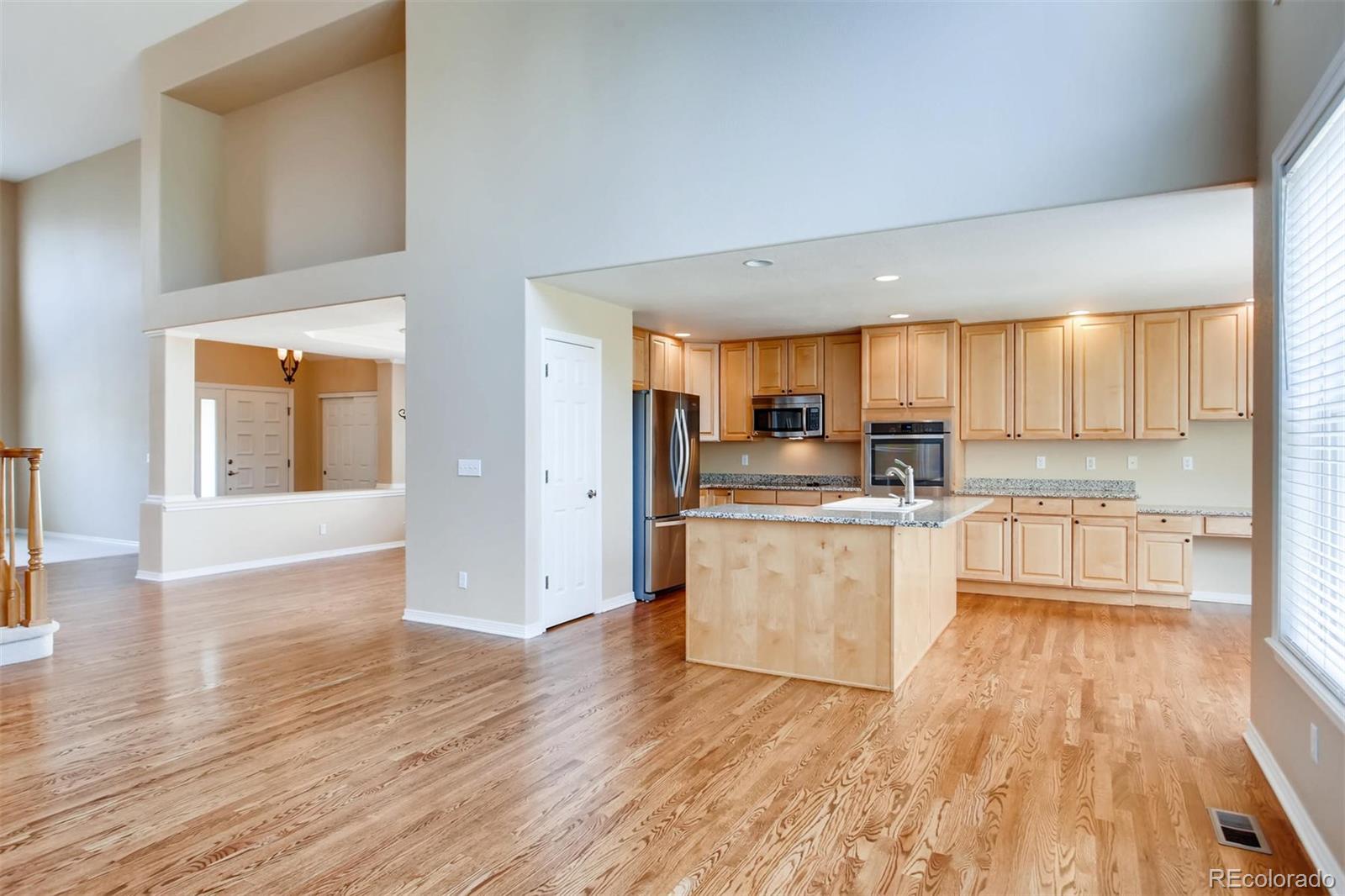 9535 East Aspen Hill Place Lone Tree, CO 80124 - Photo 4 of 28 a large kitchen with lots of counter space a sink and appliances