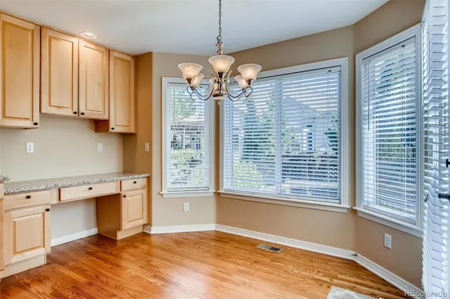 a view of a kitchen with a sink and cabinets