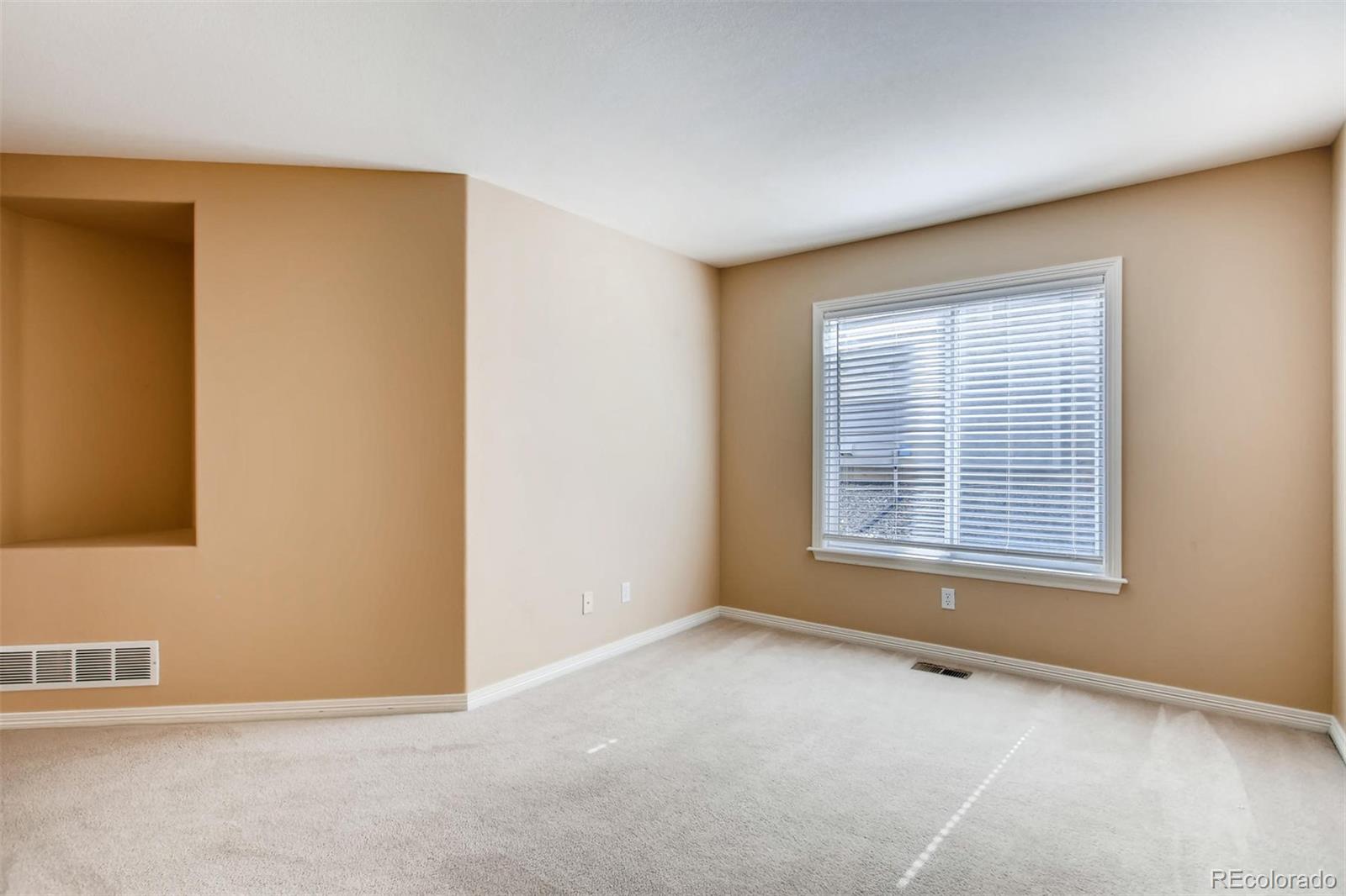 9535 East Aspen Hill Place Lone Tree, CO 80124 - Photo 8 of 28 a view of an empty room with a window
