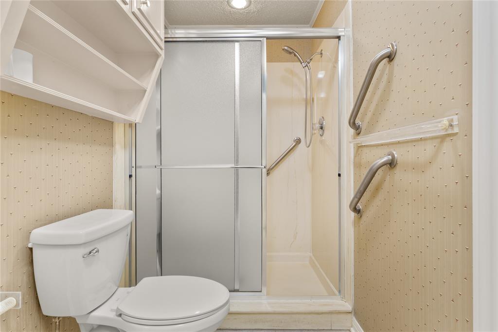 3901 Old Mill Road Waco, TX 76710 - Photo 24 of 40 a white toilet sitting next to a shower