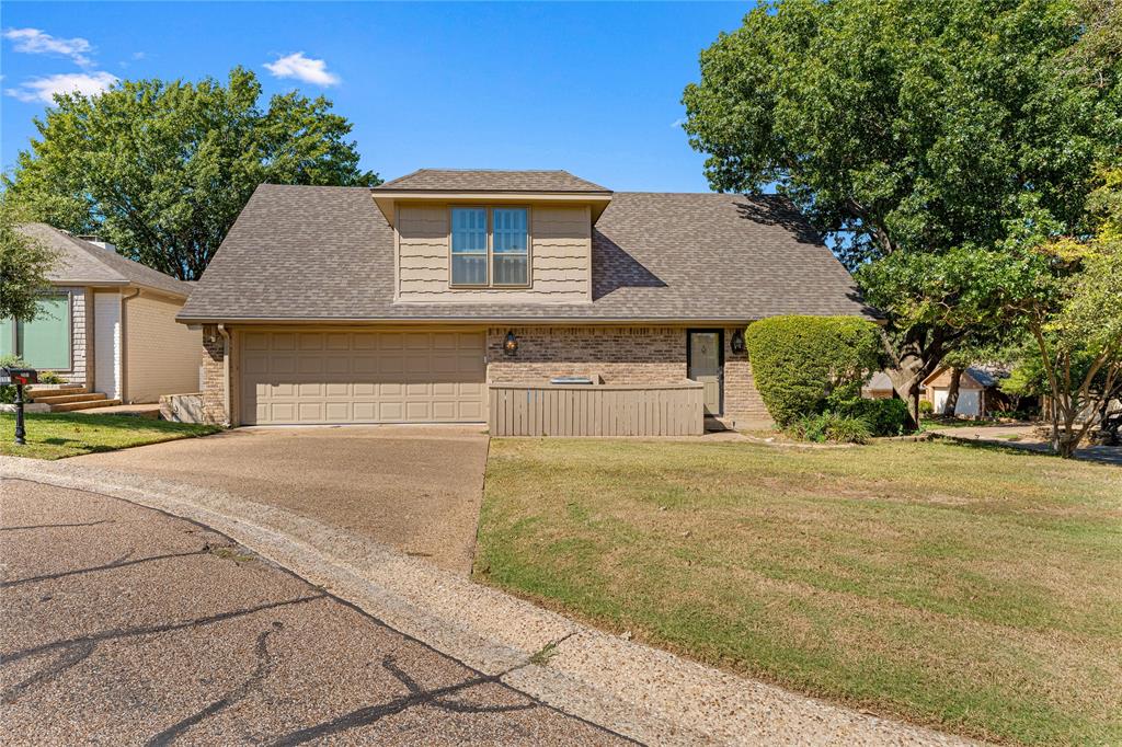 3901 Old Mill Road Waco, TX 76710 - Photo 34 of 40 a front view of a house with a yard and garage