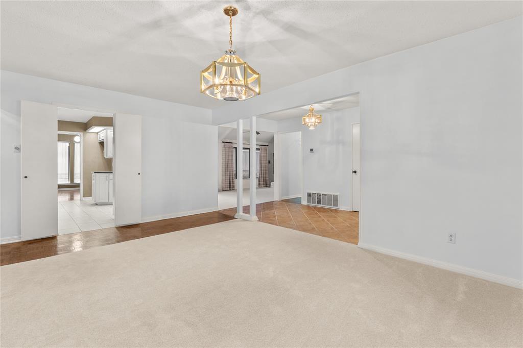 3901 Old Mill Road Waco, TX 76710 - Photo 5 of 40 a view of a hallway with a chandelier