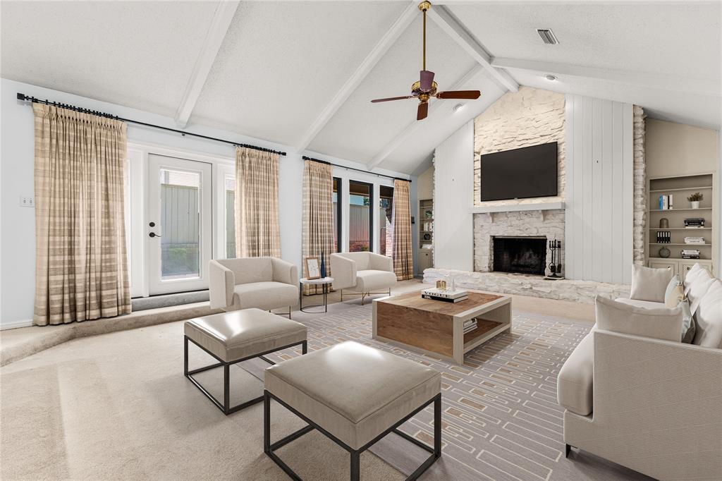 3901 Old Mill Road Waco, TX 76710 - Photo 7 of 40 a living room with furniture a flat screen tv and a fireplace