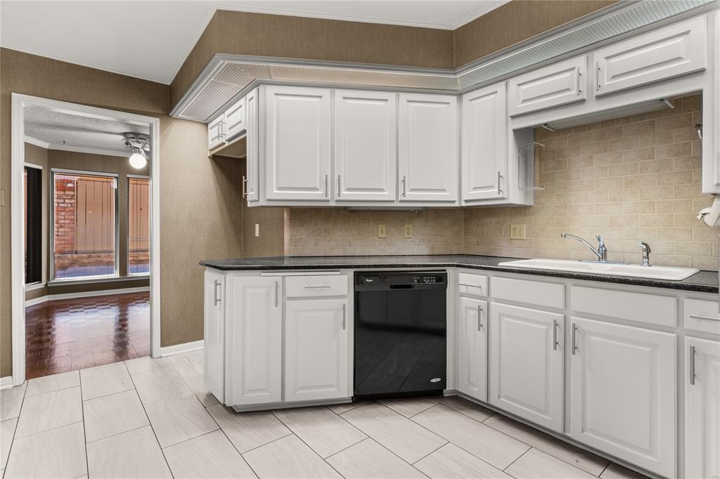 3901 Old Mill Road Waco, TX 76710 - Photo 8 of 40 a kitchen with white cabinets