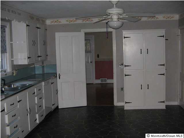 3224 Allaire Road Wall, NJ 07719 - Photo 2 of 3 a kitchen with cabinets and a wooden floors
