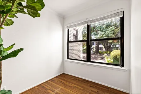 a view of a room that has a window in it