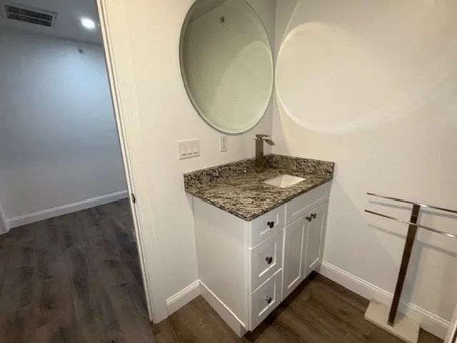 an entryway with wooden floor