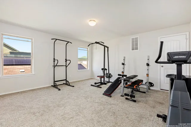 a view of a room with gym equipment