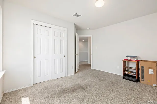 a view of room with wooden floor