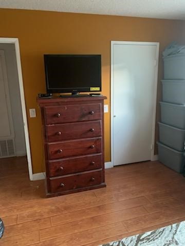 24510 Pace Drive Moreno Valley, CA 92557 - Photo 4 of 13 a room with a flat screen tv on a dresser and a fireplace