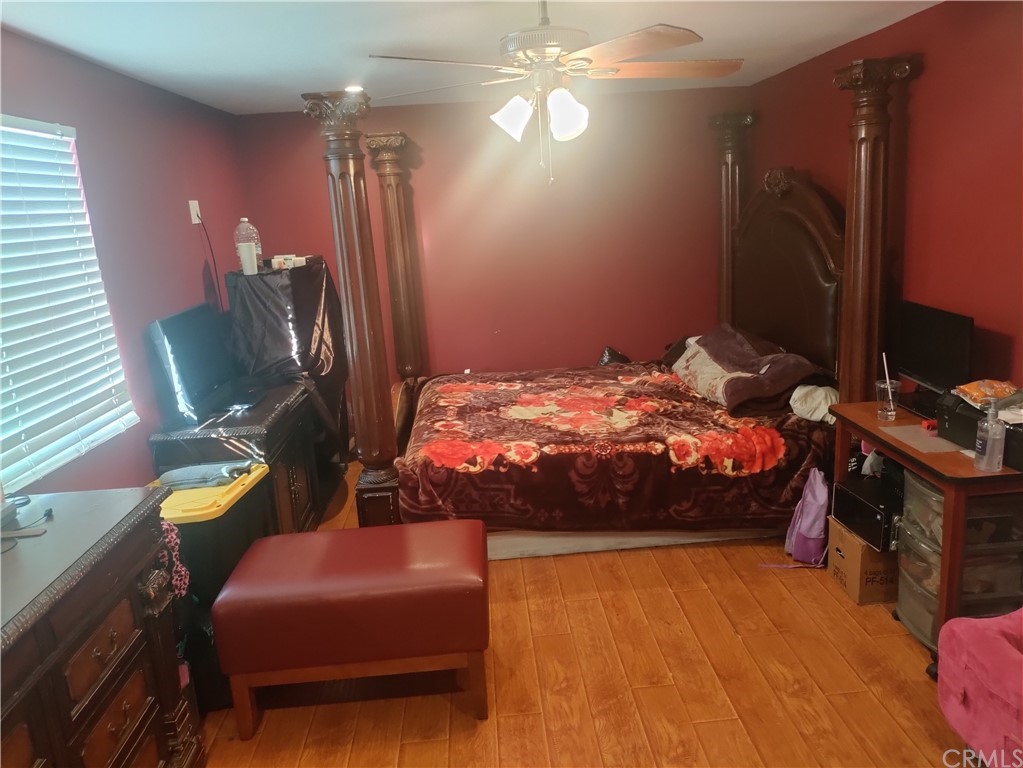 24510 Pace Drive Moreno Valley, CA 92557 - Photo 6 of 13 a bedroom with a bed dresser and a chair